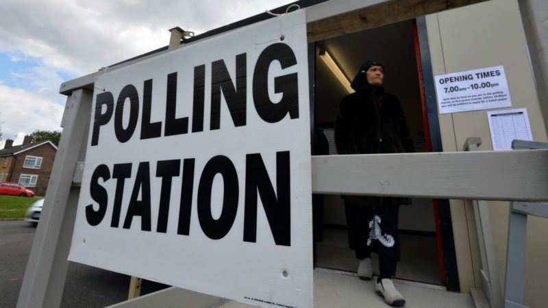 A woman leaves a temporary mobile polling station. Croydon May 2015