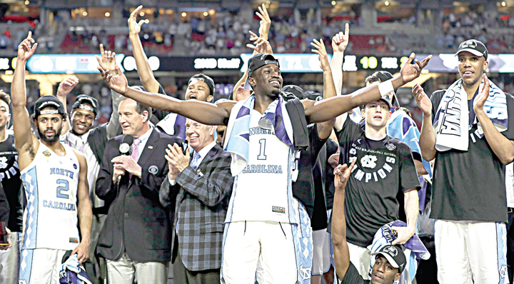 Pinson and the rest of the team celebrate on the bench