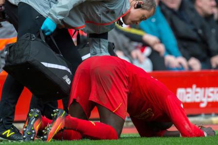 Liverpool's Sadio Mane tried to walk off but collapsed on the touchline before being substituted due to an injury