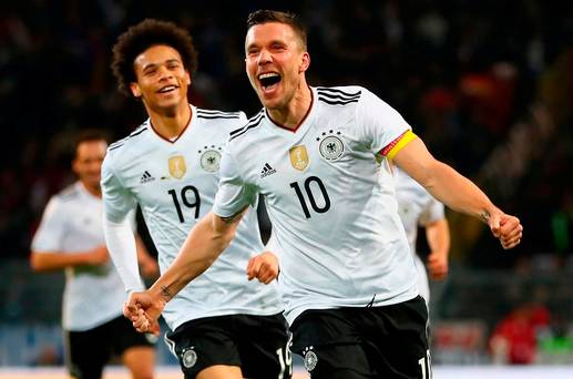 Lukas Podolski of Germany celebrates scoring his sides winner last night