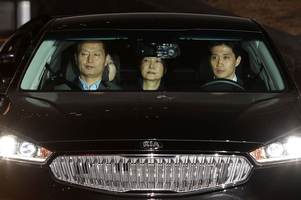 Park Geun-hye drives to a detention after being arrested