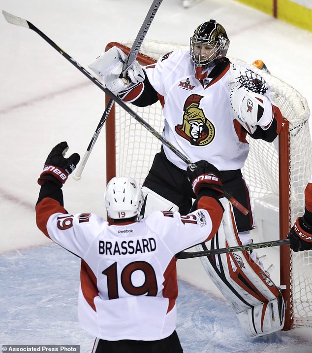 Ottawa Senators goalie Craig Anderson is congratulated by center Derick Brassard after shutting out the Boston Bruins 1-0 during Game 4 of a first-round NHL hockey playoff series in Boston Wednesday