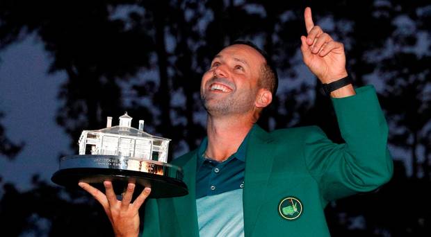 Sergio Garcia points to the sky as he holds the Masters trophy after winning at Augusta