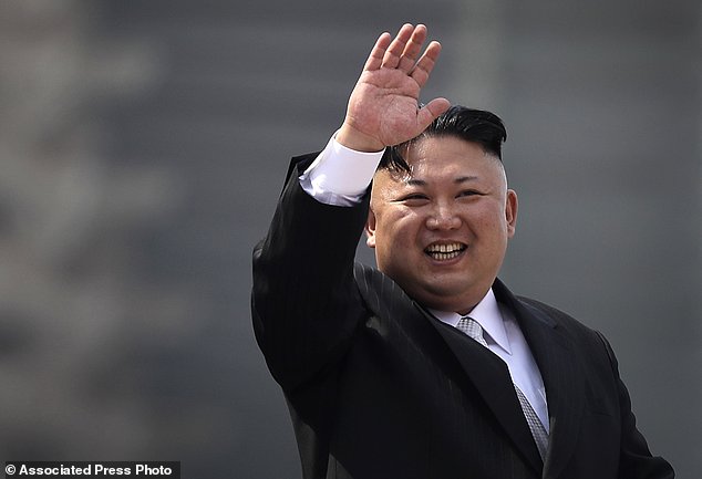 North Korean leader Kim Jong Un waves during a military parade in Pyongyang North Korea to celebrate the 105th birth anniversary of Kim Il Sung the country's late founder and grandfather of current