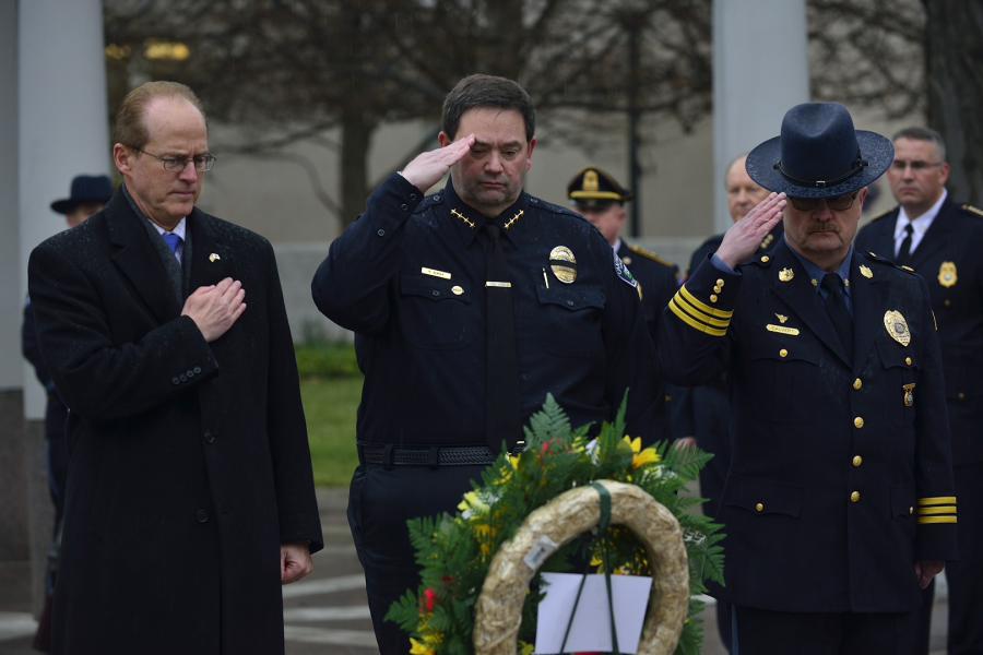 IACLEA President Randy Burba and other officials salute fallen officers