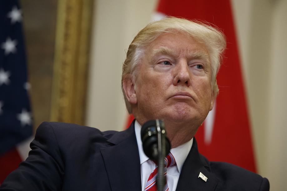 President Donald Trump listens as Turkish President Recep Tayyip Erdogan speaks in the Roosevelt Room of the White House in Washington Tuesday