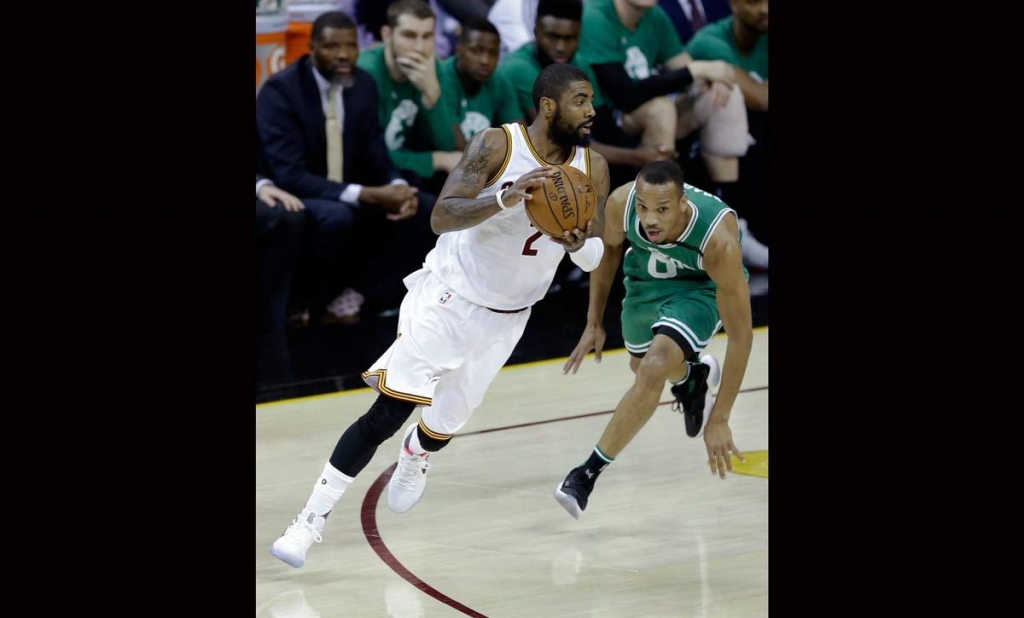 Cleveland Cavaliers&#039 Kyrie Irving drives against Boston Celtics&#039 Avery Bradley during the first half of Game 4 of the NBA basketball Eastern Conference finals Tuesday