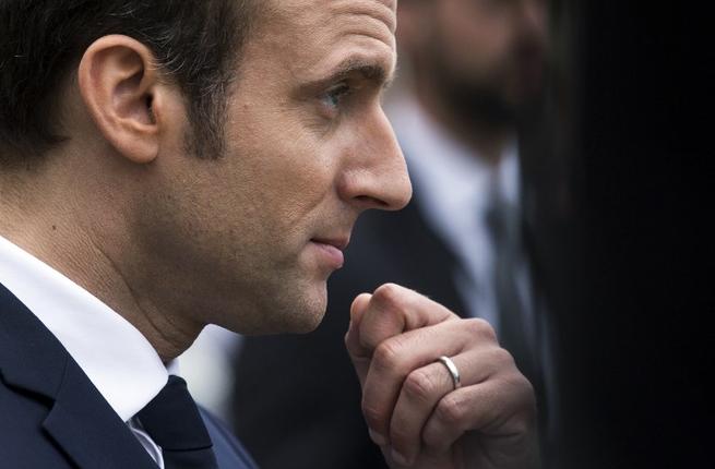 French President Emmanuel Macron looks on as he visits an exhibition about Russian emperor Peter the Great at the Grand Trianon following a meeting with his Russian counterpart at the Versailles Palace near Paris