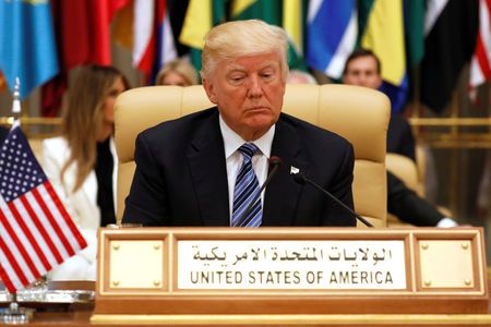 Trump takes his seat before his speech to the Arab Islamic American Summit in Riyadh