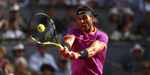 Rafael Nadal in action against Dominic Thiem in the final of the Madrid Masters