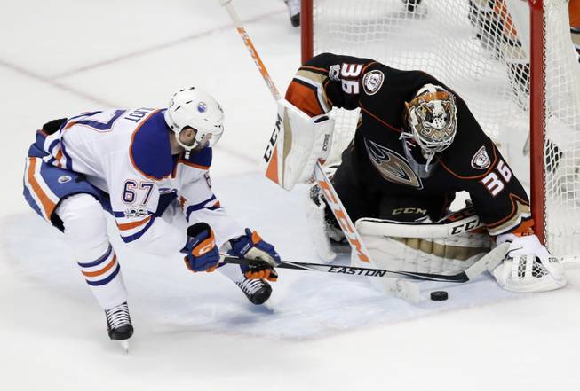 Larsson leads Oilers past Ducks 5-3 in wild series opener