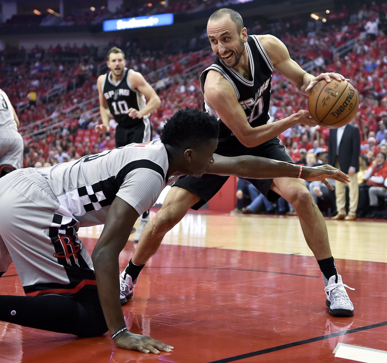 San Antonio Spurs guard Manu Ginobili right grabs a loose ball from Houston Rockets center Clint Capela during the first half in Game 6 of an NBA basketball second-round playoff series Thursday