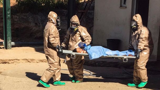 Turkish experts carry a victim of a chemical attack in Syrian city of Idlib April 2017