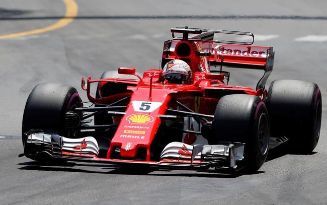 Ferrari driver Sebastian Vettel of Germany steers his car during the Formula One Grand Prix at the Monaco racetrack in Monaco Sunday