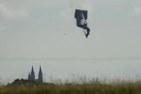 A blimp used by TV appears to crash during the first round of the U.S. Open golf tournament Thursday