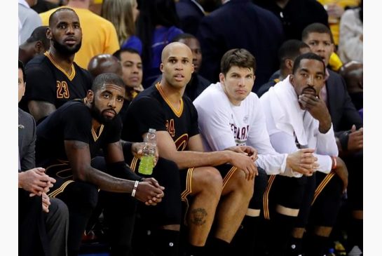 Cleveland Cavaliers Kyrie Irving seated from left Le Bron James Richard Jefferson Kyle Korver and J.R. Smith sit on the bench during the second half of Game 2 of basketball's NBA Finals against the Golden State Warriors in Oakland Calif. Sunday Jun