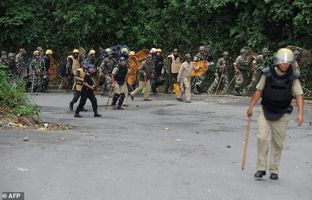 Protesters hurled petrol bombs as they clashed with police in eastern India's hill resort of Darjeeling which remained under total shutdown on Thursday local officials said