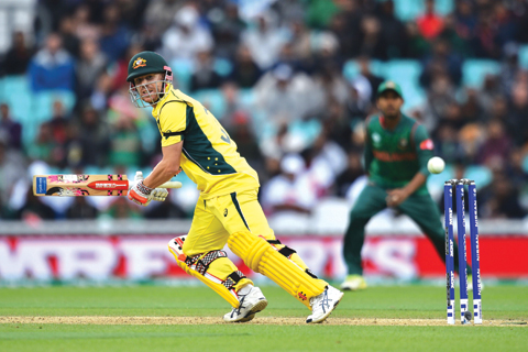 LONDON Australia’s David Warner runs during the ICC Champions Trophy match between Australia and Bangladesh at The Oval in London on Monday. — AFP