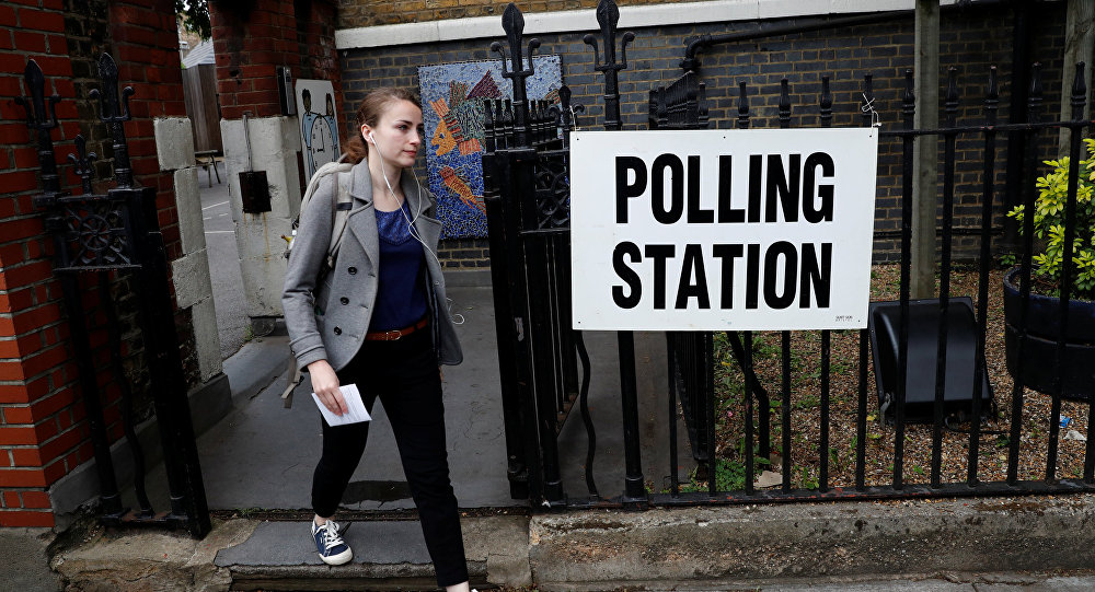 A voter arrives at a polling station in London Britain