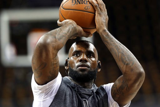 Cleveland Cavaliers forward Le Bron James shoots during warmups for Game 3 between the Cavaliers and the Golden State Warriors in basketball's NBA Finals in Cleveland Wednesday