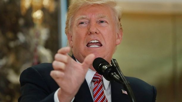 President Donald Trump speaks to the media in the lobby of Trump Tower Tuesday Aug. 15 2017 in New York