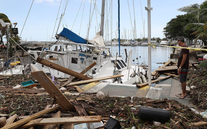 A damaged boat is seen at the Dinner Key marina after Hurricane Irma passed through the area