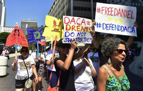 Young immigrants and supporters gather for a rally in support of Deferred Action for Childhood Arrivals in Los Angeles California