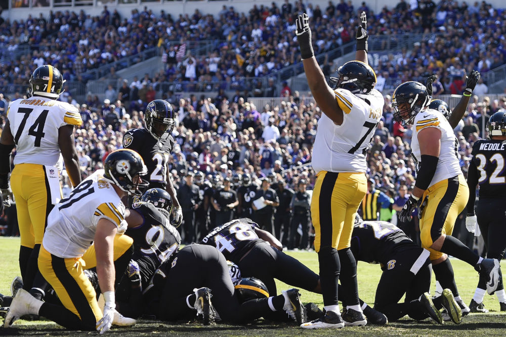 Pittsburgh Steelers offensive guard Ramon Foster celebrates running back Le'Veon Bell's touchdown during the first half of an NFL football game against the Baltimore Ravens in Baltimore Sunday Oct. 1 2017