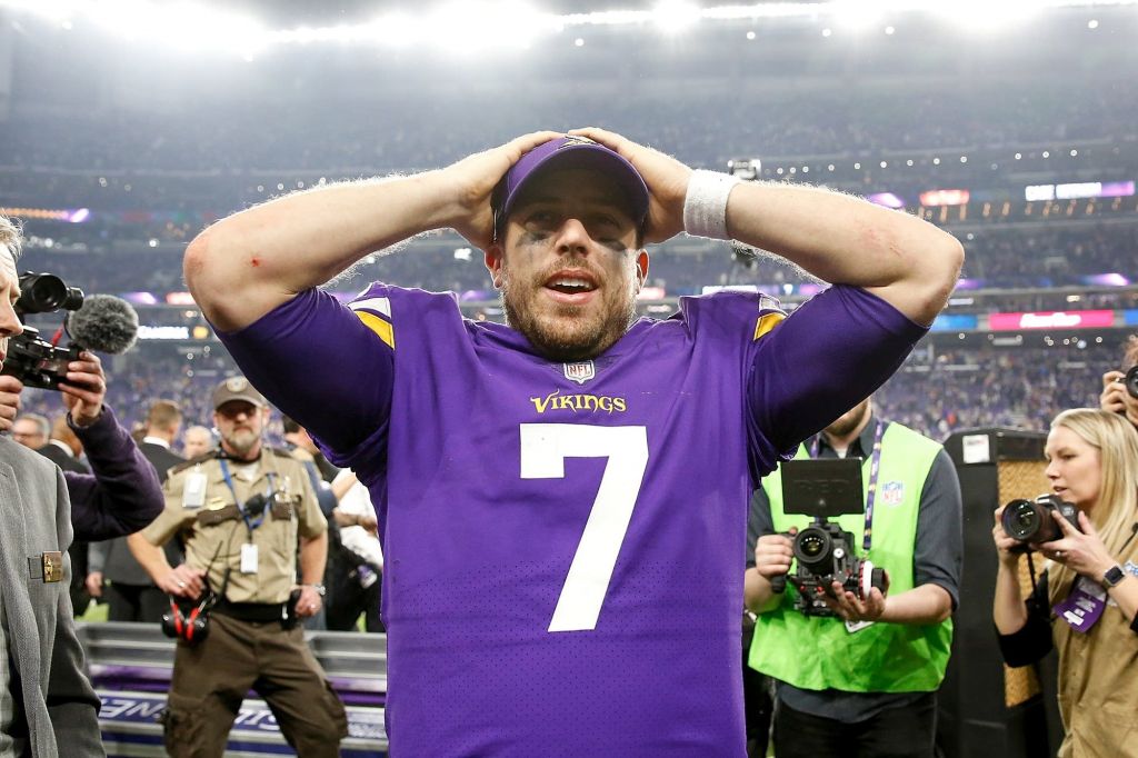 Case Keenum celebrates after defeating the New Orleans Saints