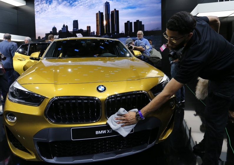 A 2018 BMW X2 Sport Activity Coupe is wiped down while on display at the North American International Auto Show in Detroit Michigan