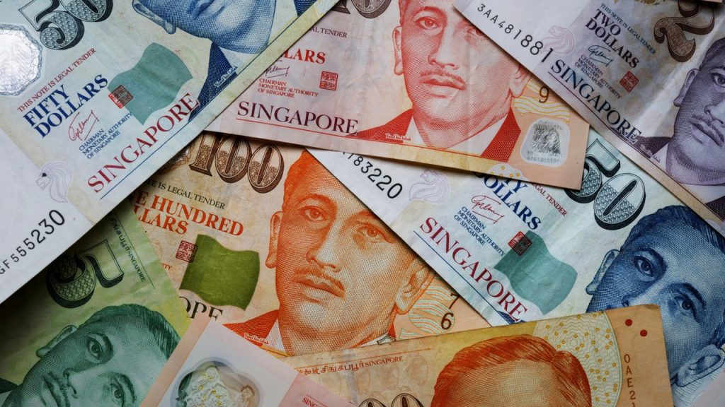 Singapore dollar surged to its highest in three years against the US dollar