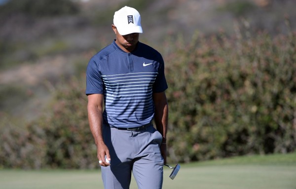 Woods brings big crowds, shoots 72