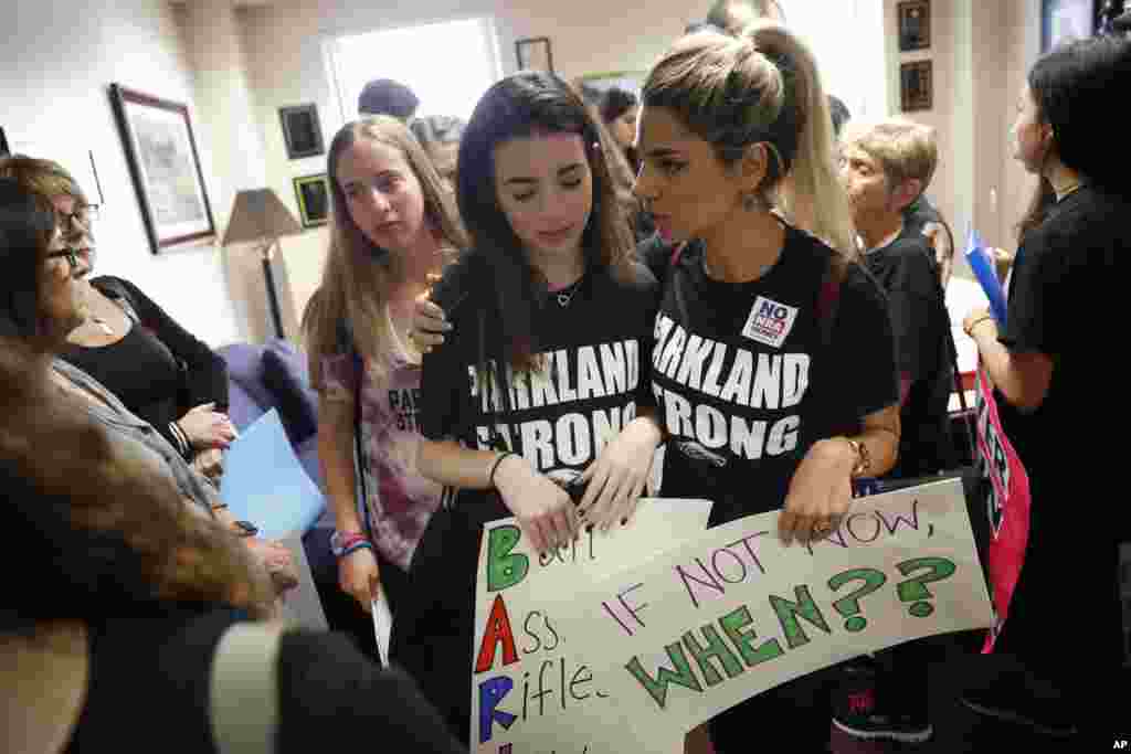 Lital Donner youth director for Congregation Kol Tikvah comforts Aria Siccone 14 a 9th grade student survivor from Marjory Stoneman Douglas High School where over a dozen were killed in a mass shooting on Wednesday