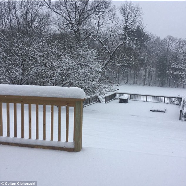 This backyard view shows snow accumulation in Lapeer Michigan on Monday morning. The winter storm is set to hit the Ohio Valley and New England with snow by Monday evening