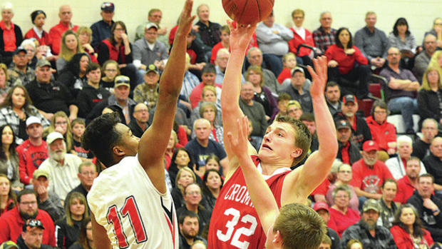 Cromwell-Wright's Cameron Cahoon goes up for a shot against the Hinckley Finlayson Jaguars. Dan Saletel  Pine Journal