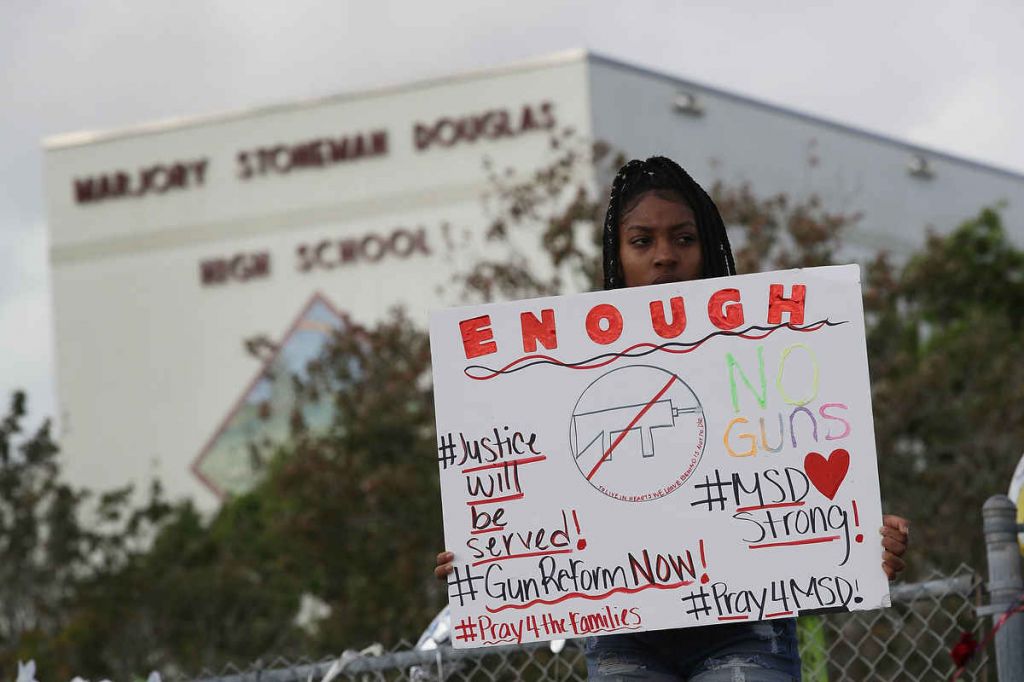 Senior Tyra Heman protests at Marjory Stoneman Douglas High School site of the U.S.’ latest school massacre. JOE RAEDLE  GETTY IMAGES