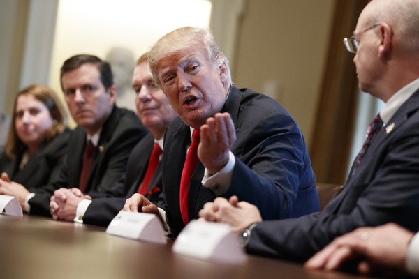 President Donald Trump speaks during a meeting with steel and aluminum executives in the Cabinet Room of the White House. From left Beth Ludwig of AK Steel Roger Newport of AK Steel John Ferriola of Nucor Trump and Dave Burritt of U.S. Steel Corporat