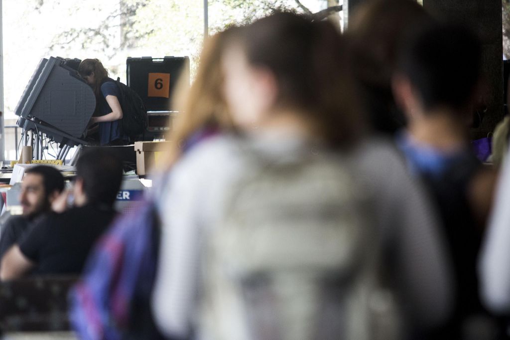 Voters cast ballots Tuesday at the Flawn Academic Center on the campus of UT Austin