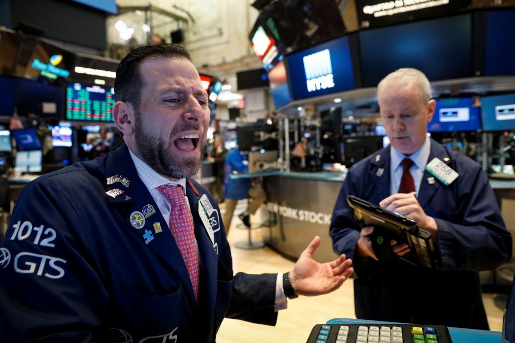 Traders on the floor of the New York Stock Exchange yesterday. The Dow Jones Industrial Average rose 240.92 points to close at 24,505.22