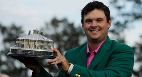 Patrick Reed holds the championship trophy after winning the Masters golf tournament Sunday