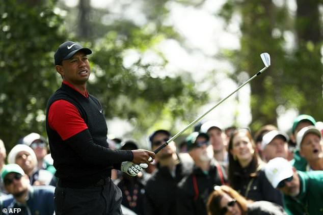 Tiger Woods of the United States plays his shot from the fourth tee during the final round of the 2018 Masters Tournament