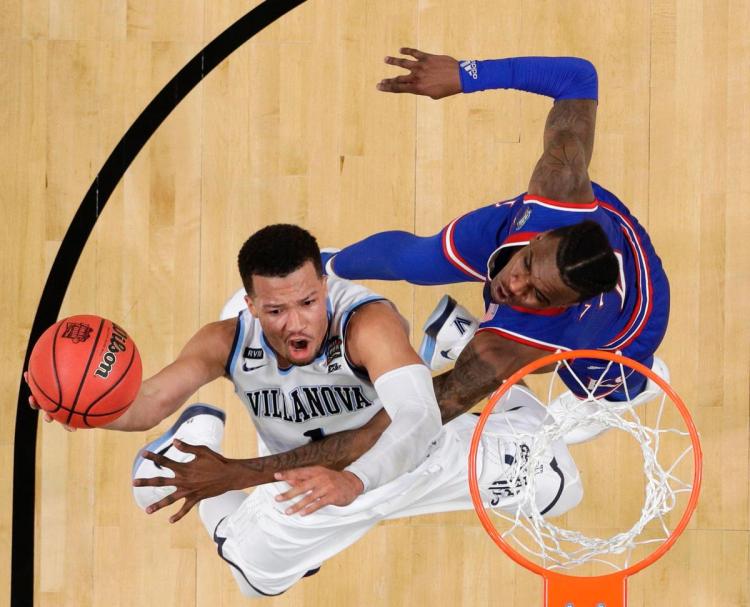 Villanova's Jalen Brunson shoots over Kansas's Lagerald Vick during the second half in the semifinals of the Final Four NCAA college basketball tournament Saturday