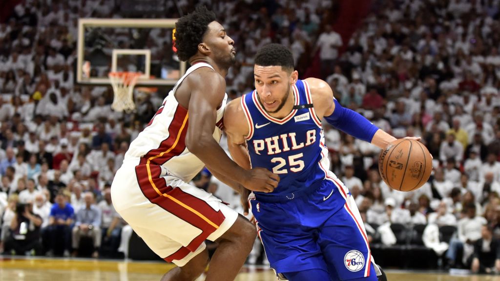 76ers forward Ben Simmons drives past Heat forward Justise Winslow