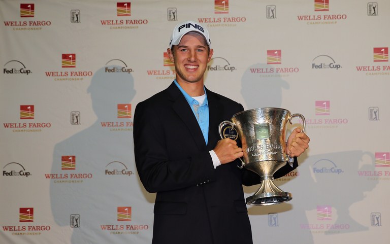 Derek Ernst poses with the trophy after defeating David Lynn of England in a playoff on the 18th hole during the final round of the Wells Fargo Championship at Quail Hollow Club