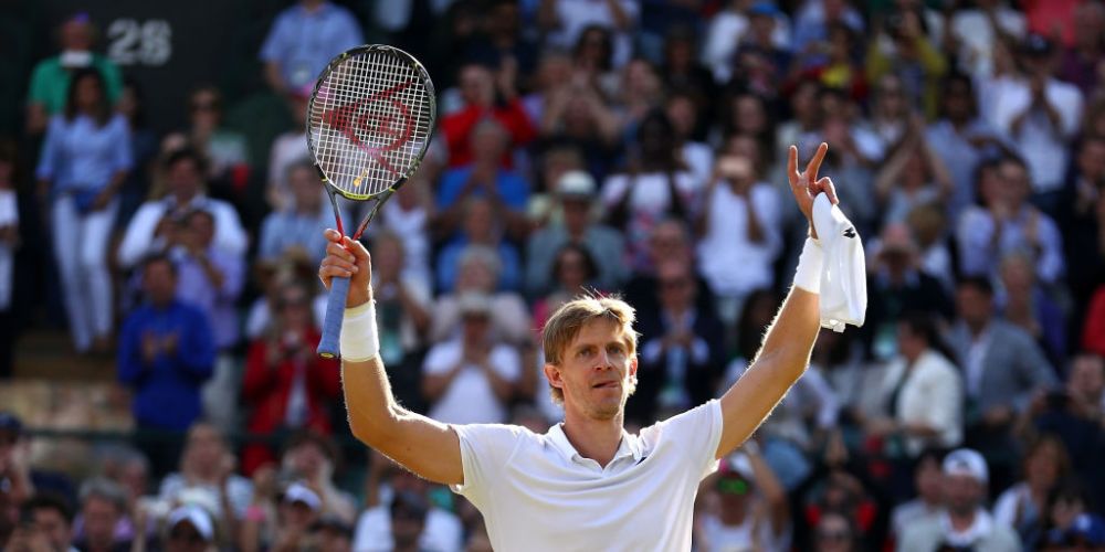 Kevin Anderson of South Africa celebrates winning match point against Roger Federer of Switzerland on day nine of the Wimbledon Lawn Tennis Championships at All England Lawn Tennis and Croquet Club