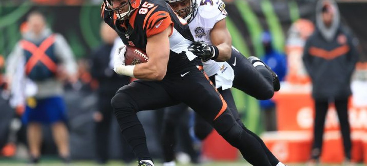 Dalton in coat, stands around during practice _ a step back