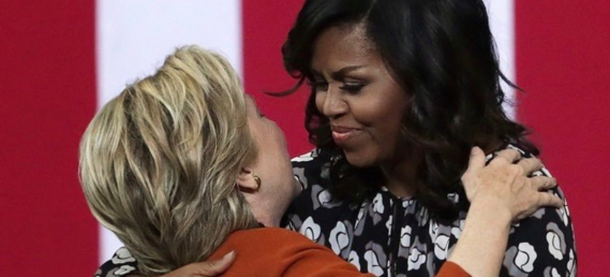 Clinton rallies with Mrs. Obama as Trump alleges corruption