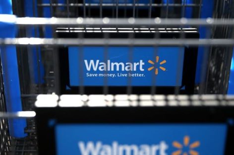 Wal-Mart plans to slow new store openings, invest in online