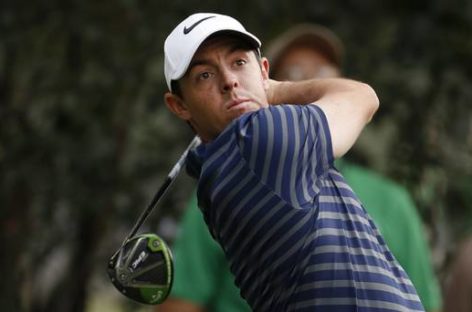 Rory McIlroy makes light of illness and layoff to move into contention