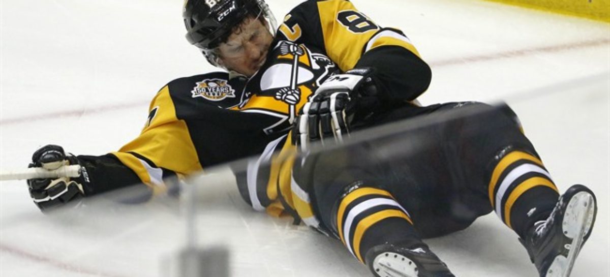 Concussed Crosby skates at Penguins practice facility